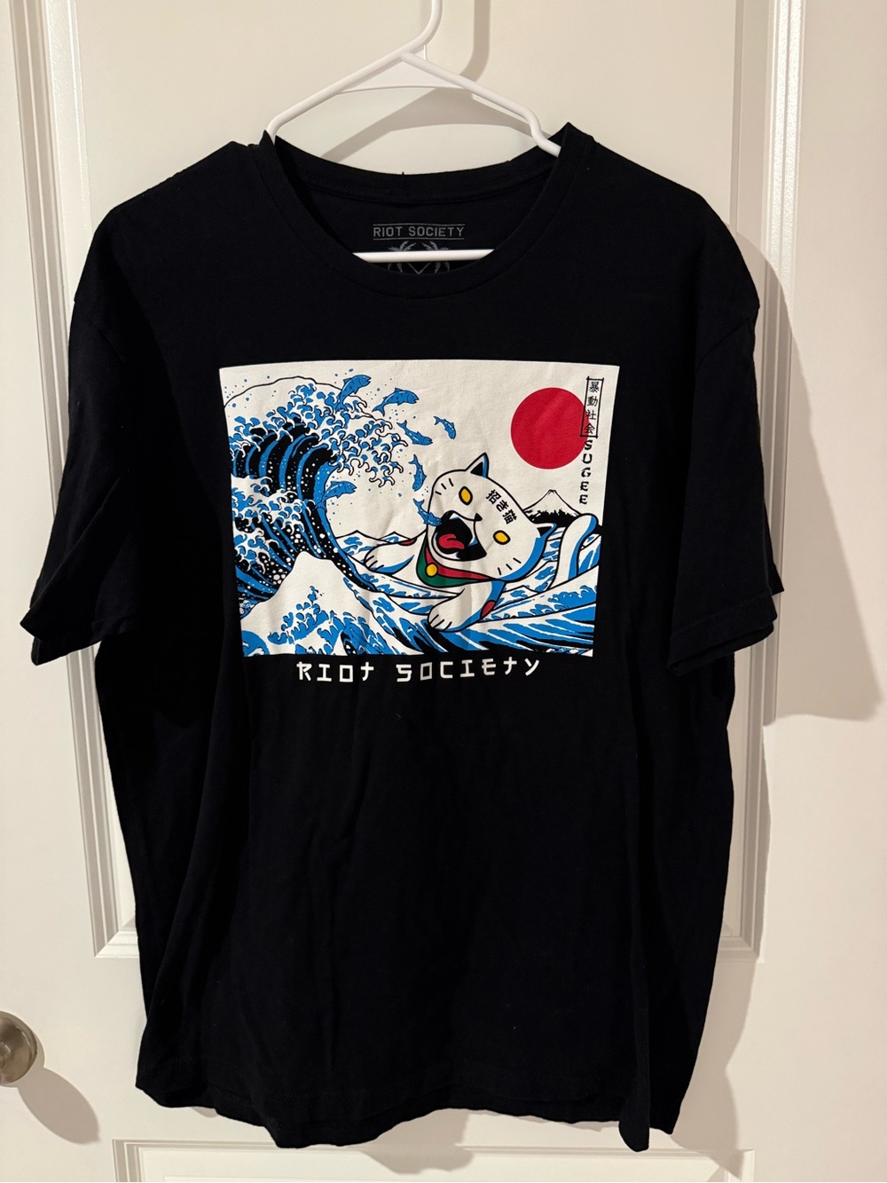 riot society Black Tee with Blue Wave and Red Sun Cat Graphic